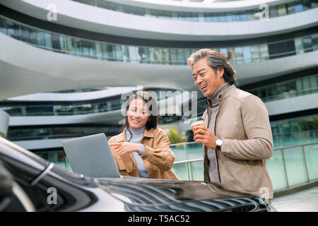 Business people use computers in the outdoor Stock Photo