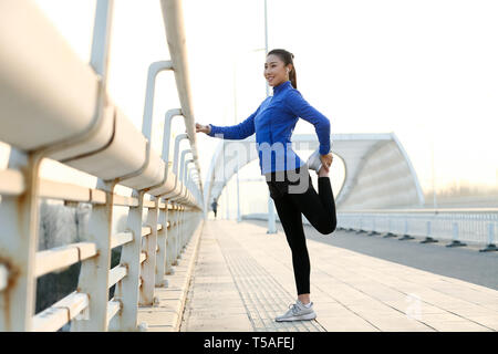 Outdoor fitness young woman Stock Photo