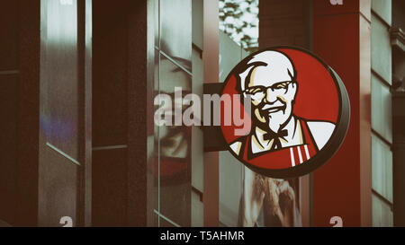 Kentucky Fried Chicken (KFC) Logo at the street,KFC is an American fast food restaurant chain headquartered in Louisville, USA. Stock Photo
