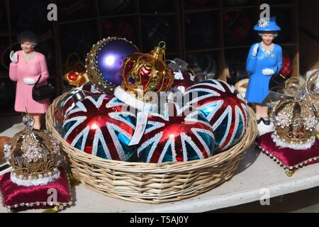 Various British trinkets including British flag and the Queen on display in a shop window in Edinburgh, Scotland, UK Stock Photo