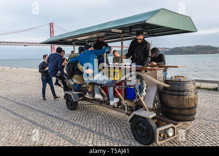 Beer bike o na boardwalk of Tagus River in Lisbon Stock Photo