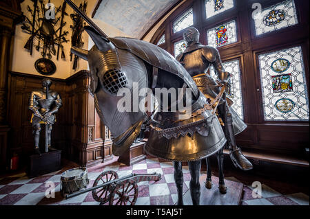 Full knight and horse armour in Grand Armory Hall in Peles Palace, former royal castle, built between 1873 and 1914, located near Sinaia city in Roman Stock Photo
