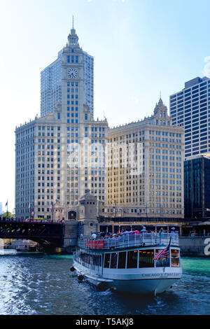 Chicago First Lady tourist ferry passing Wrigley building, DuSable Bridge and Michigan Avenue on River Chicago at Downtown Stock Photo