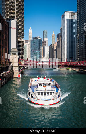 Tourist Ferry on Chicago River just passing Clark Street Bridge in ...