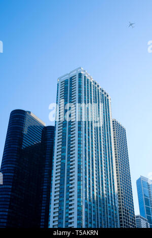 Airplane flying over Downtown Chicago Stock Photo