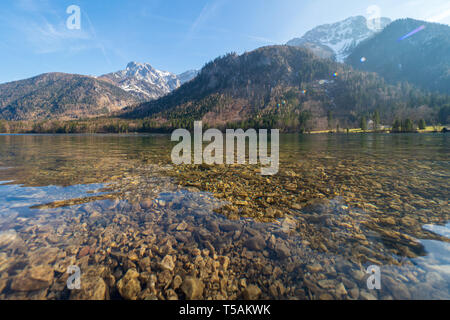 Scenic view of the great landscape reflecting on the shallow crystal clear water of the Vorderer Langbathsee near Ebensee, Oberösterreich, Austria Stock Photo