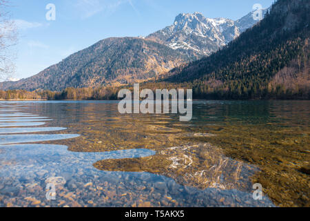 Scenic view of the great landscape reflecting on the shallow crystal clear water of the Vorderer Langbathsee near Ebensee, Oberösterreich, Austria Stock Photo