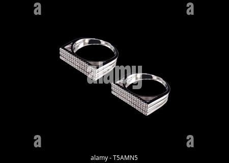Rings with precious stones on a black background Stock Photo