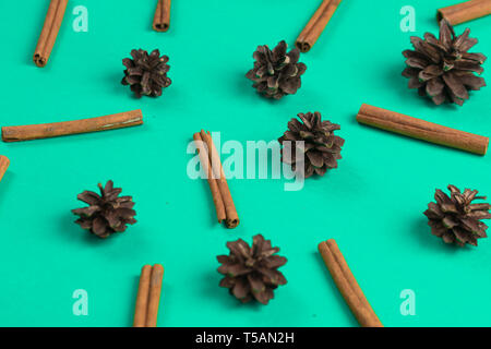 collection of cones and cinnamons on the blue table.creative composition for party. Stock Photo