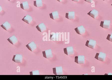 Cubes of sugar isolated on pink background. food concept. make your life sweet Stock Photo