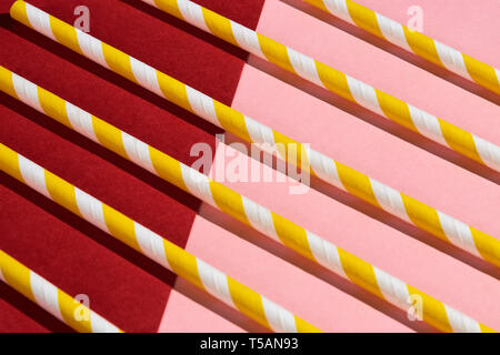 several yellow and white straws in retro style, close up top view Stock Photo