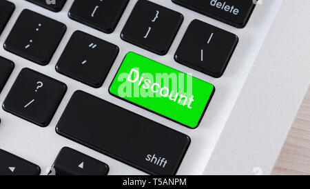 Discount word on button of laptop keyboard Stock Photo