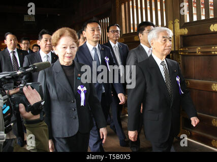 Tokyo, Japan. 23rd Apr, 2019. Japanese lawmakers led by former Health Minister Hidehisa Otsuji (R) follow a Shinto priest during their visit to the controversial Yasukuni shrine to honour the war dead in Tokyo on Tuesday, April 23, 2019. Some 100 Japanese lawmakers and their secretaries paid homage at the controversial shrine for the shrine's spring festival. Credit: Yoshio Tsunoda/AFLO/Alamy Live News Stock Photo