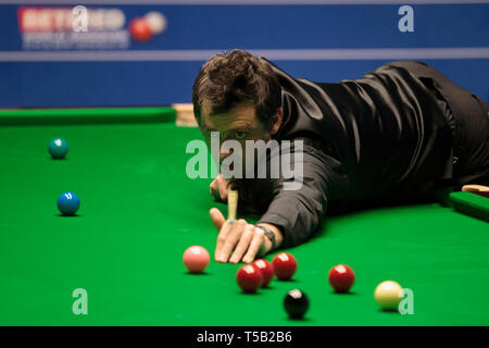 Sheffield. 22nd Apr, 2019. England's Ronnie O'Sullivan competes during the first round match with England's James Cahill at World Snooker Championship 2019 in Sheffield, Britain on April 22, 2019. Credit: Jon Super/Xinhua/Alamy Live News Stock Photo