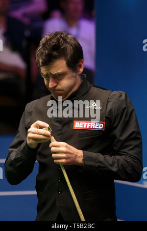 Sheffield. 22nd Apr, 2019. England's Ronnie O'Sullivan reacts during the first round match with England's James Cahill at World Snooker Championship 2019 in Sheffield, Britain on April 22, 2019. Credit: Jon Super/Xinhua/Alamy Live News Stock Photo