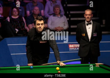 Sheffield. 22nd Apr, 2019. England's Ronnie O'Sullivan reacts during the first round match with England's James Cahill at World Snooker Championship 2019 in Sheffield, Britain on April 22, 2019. Credit: Jon Super/Xinhua/Alamy Live News Stock Photo