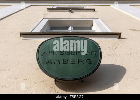 Amberg, Germany. 23rd Apr, 2019. A sign with the inscription 'Amtsgericht Amberg' is attached to the court building. Four young refugees have to answer in court because at the end of last year they allegedly attacked indiscriminately passers-by in the city centre of Amberg. Credit: Armin Weigel/dpa - ATTENTION: person(s) was/are pixelated for legal reasons/dpa/Alamy Live News Stock Photo
