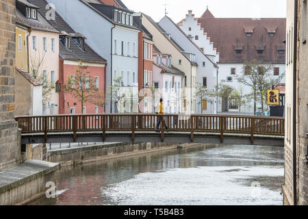 Amberg, Germany. 23rd Apr, 2019. Walkers are on a bridge over the Vils. Credit: Armin Weigel/dpa/Alamy Live News Stock Photo
