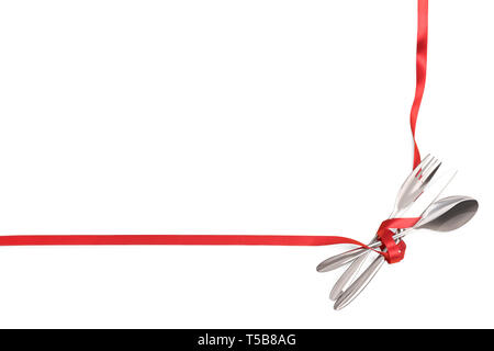 Fork, spoon and knife tied with a red ribbon. Isolated on white, clipping path included. Food, restaurant and table setting theme template with copy s Stock Photo