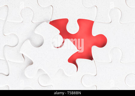 Jigsaw puzzle close up with last unfinished part. Clipping path on the empty palce Stock Photo
