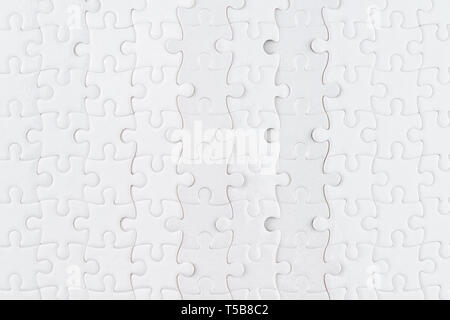 White jigsaw puzzle close up. Background and texture Stock Photo