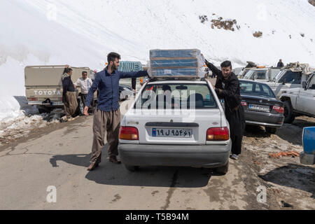 Smugglers Loading Car In Uraman Valley In Winter, Kurdistan Province, Iran
