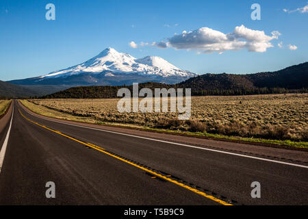 Mount Shasta, as viewed from far Northern California looking south along the highway. Stopped along the highway looking back to the volcanic peak cove Stock Photo