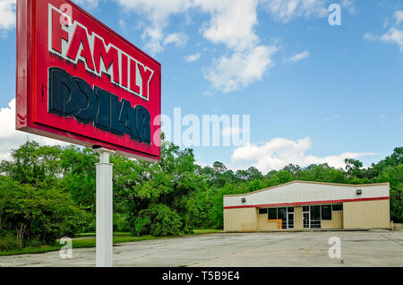A Family Dollar sign is marked with black paint after the store’s closure,  April 19, 2019, in Bayou La Batre, Alabama. Stock Photo