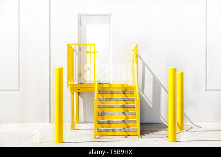 Bright yellow staircase and a white wall Stock Photo