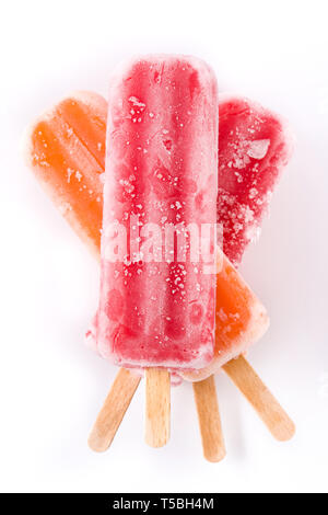 Orange and strawberry popsicles isolated on white background. Stock Photo