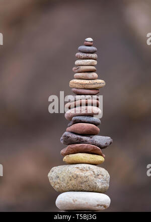 Stack of stones supported on rock Stock Photo