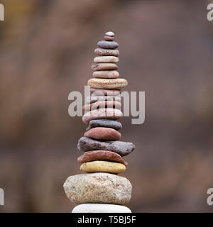 Stack of stones supported on rock Stock Photo