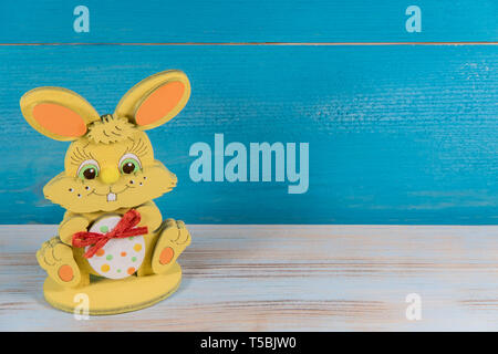 Easter toy bunny on blue background, Easter concept Stock Photo