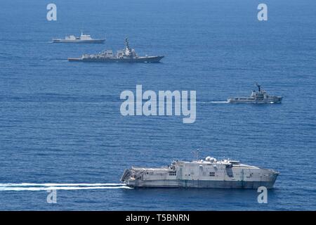 190420-N-GC639-1110 INDIAN OCEAN (April 20, 2019) – Front to back; the expeditionary fast transport ship USNS Millinocket (T-EPF 3), the Sri Lanka navy vessel SLNS Samudura (P 621), the guided-missile destroyer USS Spruance (DDG 111), and the Sri Lanka navy warship SLNS Sayurala (P 623) transit the Indian Ocean performing formation maneuvers during the sea phase of the U.S. Navy’s 25th annual Cooperation Afloat Readiness and Training (CARAT) exercise series with the Sri Lanka navy, April 20, 2019. U. S. Sailors and Marines join the Sri Lanka Armed Forces to conduct partnered training that focu Stock Photo