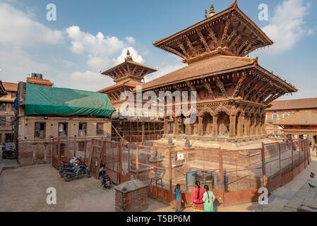 LALITPUR, PATAN, NEPAL - APRIL 3, 2019: Two temples in reconstruction after the 2015 earthquake on the Durbar Square of Patan Stock Photo