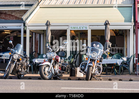 Motorcycles parked outside Smiley's restaurant in the arches on Western Esplanade at Southend on Sea, Essex, seafront on a sunny day Stock Photo