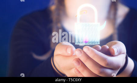teenage girl with braids, holding a digital lock in her hands, ideal for themes such as technology and online safety Stock Photo
