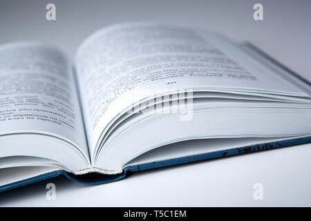 new open book with on a gray table close up Stock Photo
