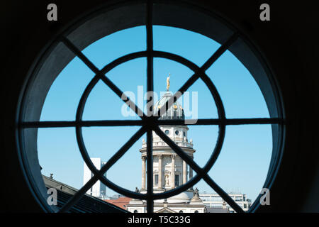 Window view on historic French Cathedral / Dome at Gendarmenmarkt, Berlin -