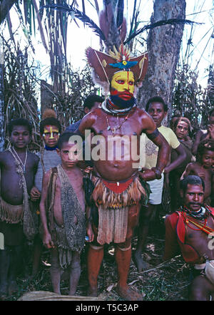 Papua New Guinea. Southern Highlands. Local Huli tribesman with children. Stock Photo