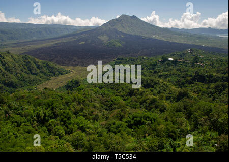 The active volcano of Mount Batur with the remanence of a previous lava flow in Bali, Indonesia Stock Photo