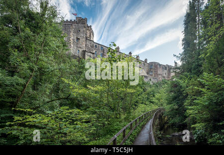 Panoramic view on Skipton Castle as seen from the footbridge in Skipton Woods Stock Photo