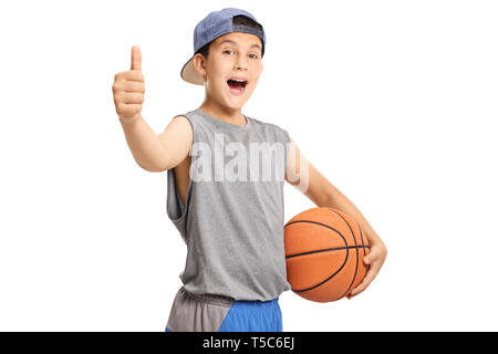 Cool teenage boy with a basketball showing thumbs up isolated on white background Stock Photo