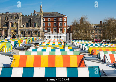 Colourful striped roofs of Norwich city market with the Guildhall to the rear. Norfolk, East Anglia, England, UK. Stock Photo