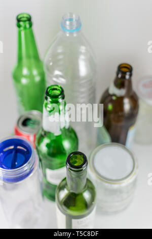 Sets of empty pot, bowl, glass bottles and plastic bottles with no label on a white background. Reuse, Eco-Friendly, Environment, Conservation Stock Photo