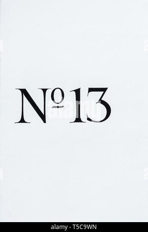 No 13 house number painted on a white wall. London, UK Stock Photo