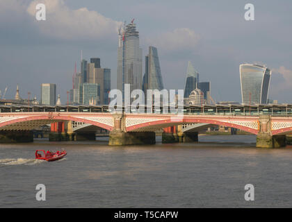 London skyline from the South Bank of skyscapers and Blackfriars Bridge with tourist boat on River Thames, London, United Kingdom Stock Photo