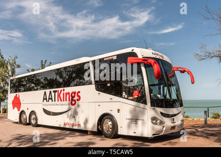 Darwin Australia - February 22, 2019: Closeup of White and red AATKings tourist bus at East Point Shoreline parked under blue sky. Stock Photo