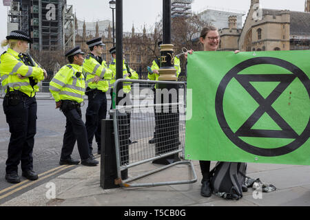 Police officers seal off Parliament Square during the week-long protest by climate change activists with Extinction Rebellion's campaign to block road junctions and bridges around the capital, on 23rd April 2019, in London England.