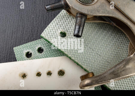 Work In An Old Craft Workshop Making Holes In The Skin And Other Materials Dark Background Stock Photo Alamy